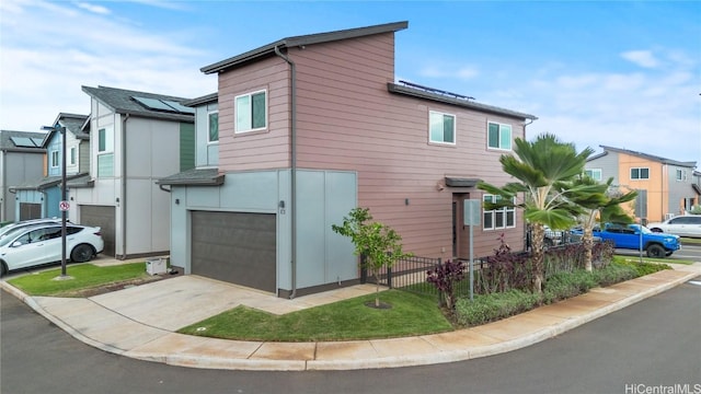 view of side of property with a garage