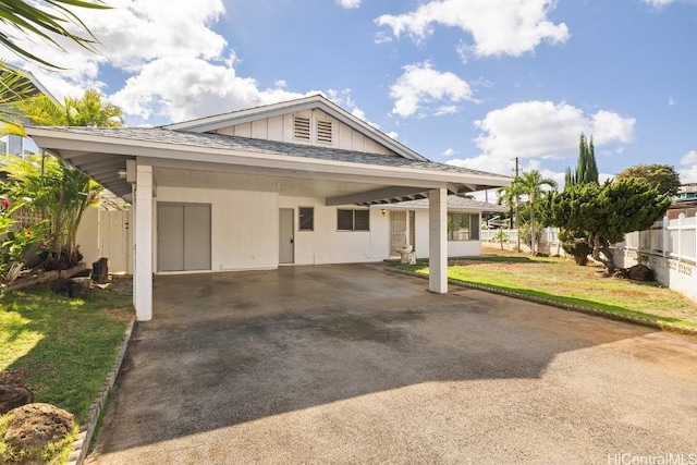 view of front of home featuring a carport