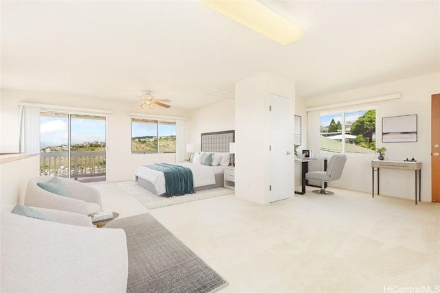 bedroom featuring ceiling fan, light colored carpet, and access to outside