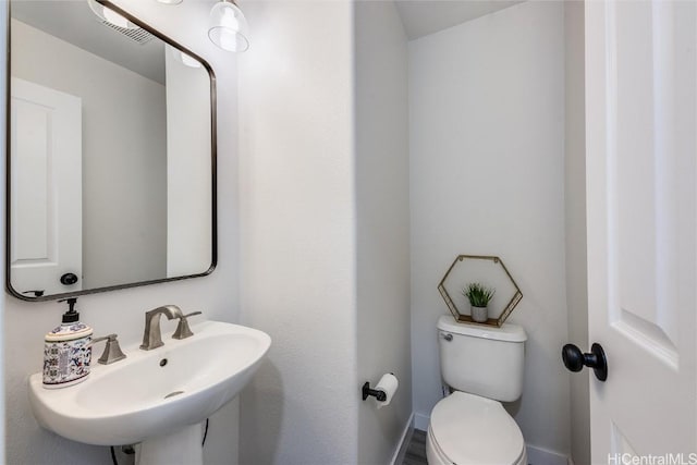 bathroom with sink and toilet