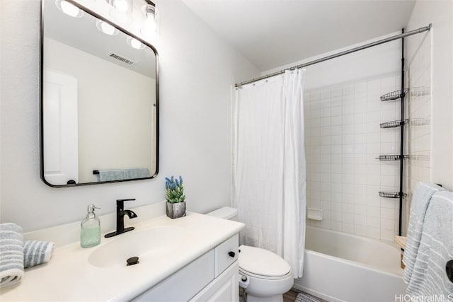 full bathroom featuring shower / bath combination with curtain, vanity, and toilet