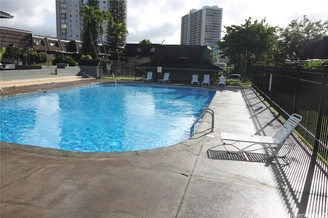 view of swimming pool with a patio area