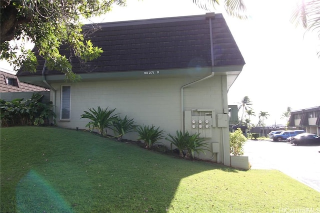 view of home's exterior featuring a yard