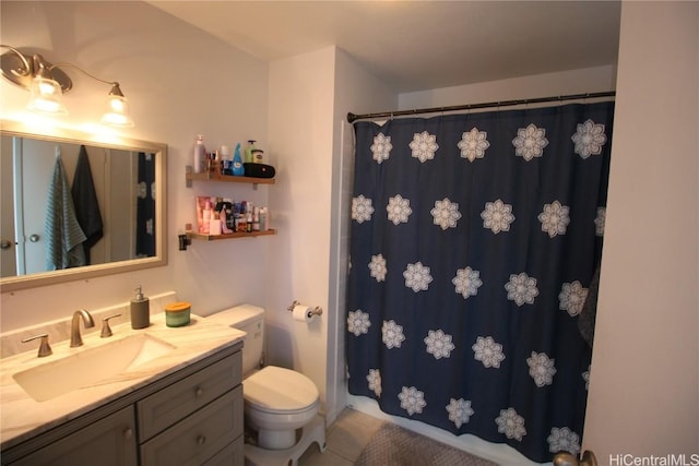 bathroom featuring vanity, toilet, and a shower with shower curtain