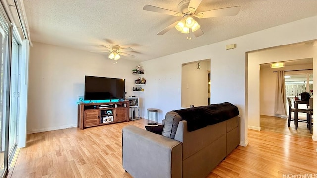 98-271 Kaonohi St Unit H2, Aiea, HI 96701 - living room with ceiling fan, a textured ceiling, and light hardwood / wood-style floors