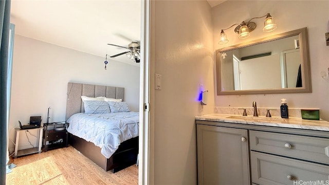 98-271 Kaonohi St Unit H2, Aiea, HI 96701 - bathroom with ceiling fan, vanity, and hardwood / wood-style floors