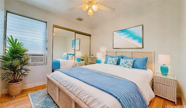 98-271 Kaonohi St Unit H2, Aiea, HI 96701 - bedroom with a closet, cooling unit, ceiling fan, and light hardwood / wood-style flooring