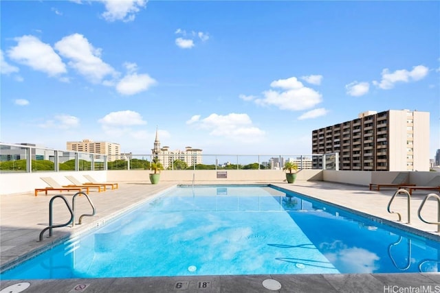 view of swimming pool featuring a patio