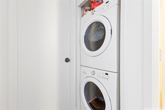 washroom with stacked washer / drying machine