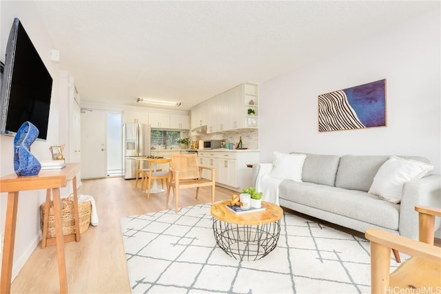 living room with light hardwood / wood-style flooring