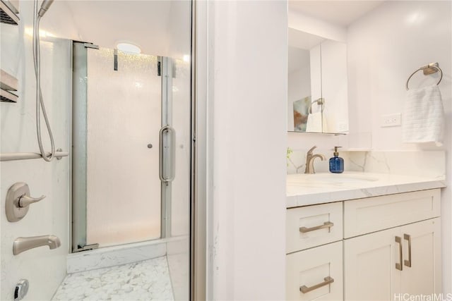 bathroom with vanity and an enclosed shower