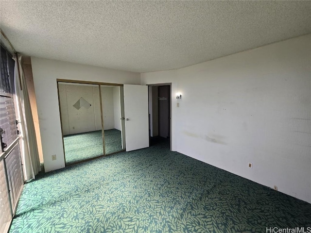 unfurnished bedroom with a textured ceiling and a closet