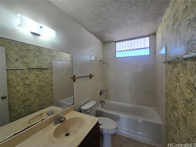 full bathroom with vanity, a textured ceiling, shower / bath combination, and toilet