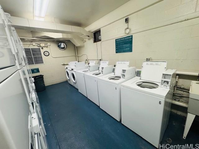 clothes washing area featuring independent washer and dryer