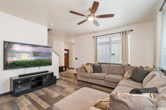 living room with wood-type flooring and ceiling fan