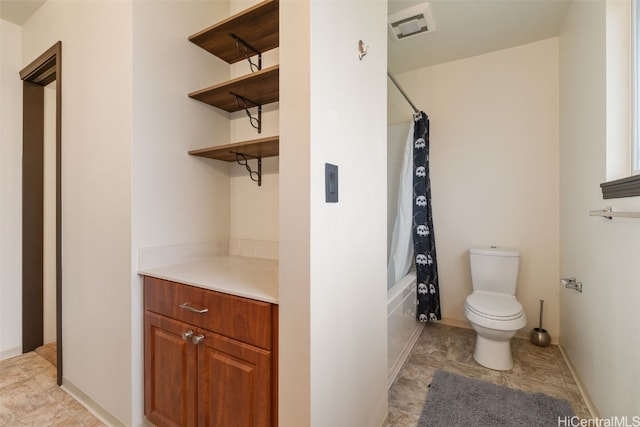 bathroom with shower / bath combination with curtain and toilet