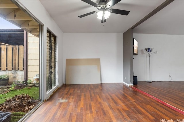 spare room with ceiling fan and dark wood-type flooring