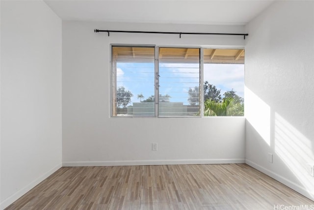 unfurnished room featuring light hardwood / wood-style floors