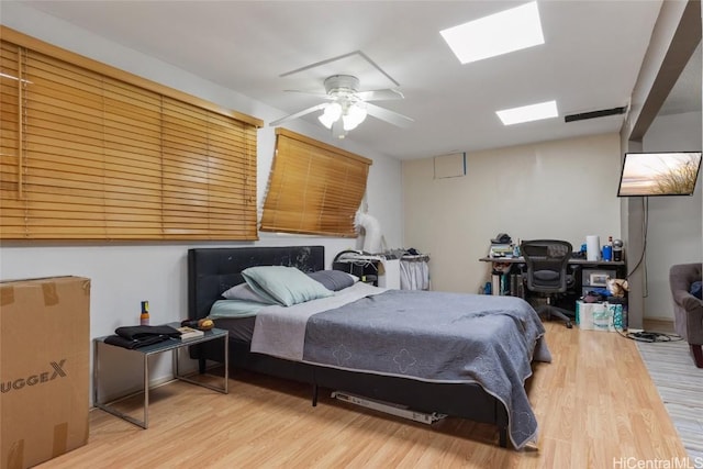 bedroom featuring ceiling fan and hardwood / wood-style floors