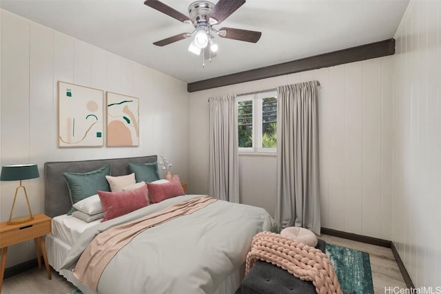 bedroom with ceiling fan and light hardwood / wood-style flooring