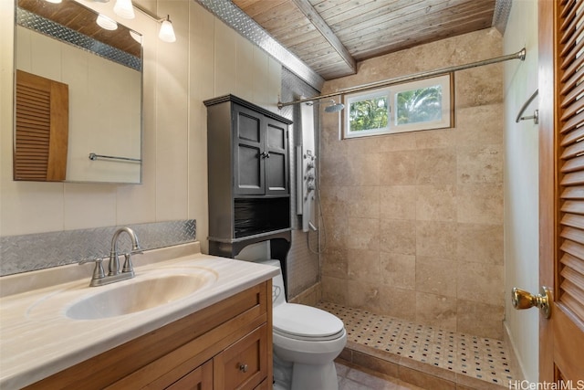 bathroom with wooden ceiling, a tile shower, vanity, and toilet