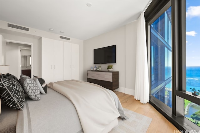 bedroom featuring light wood-type flooring