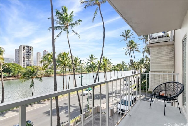 balcony featuring a water view