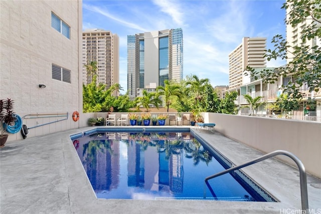 view of pool featuring a patio area