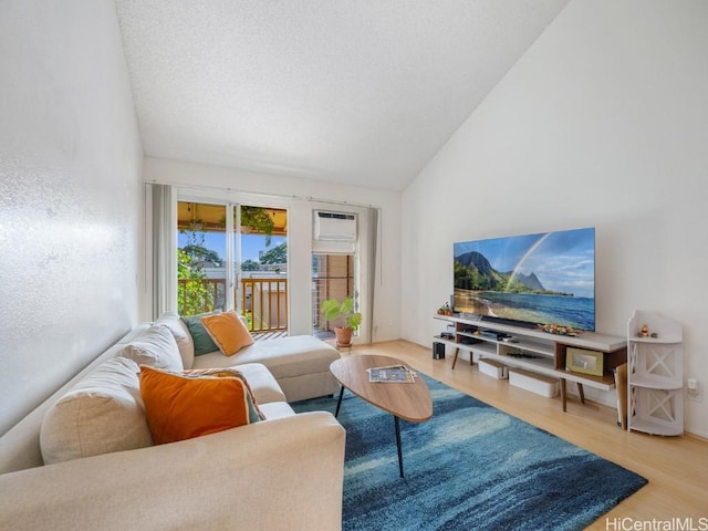 living room featuring hardwood / wood-style flooring and high vaulted ceiling