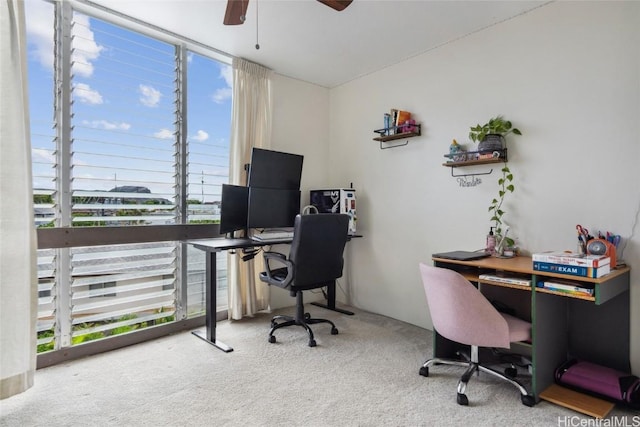 home office with carpet floors and ceiling fan