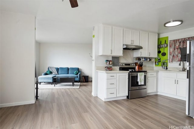 kitchen with ceiling fan, light hardwood / wood-style flooring, white cabinets, and stainless steel appliances