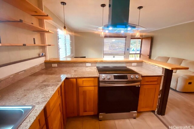 kitchen featuring sink, kitchen peninsula, decorative light fixtures, stainless steel range with electric stovetop, and island range hood