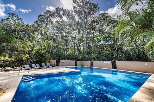 view of swimming pool with a patio area