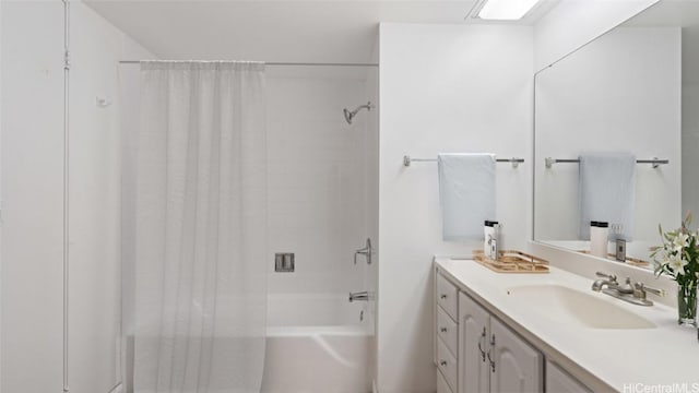 bathroom with shower / tub combo with curtain and vanity