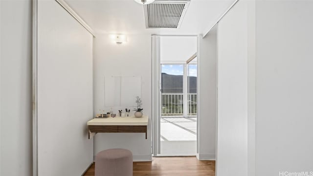 hallway with wood-type flooring