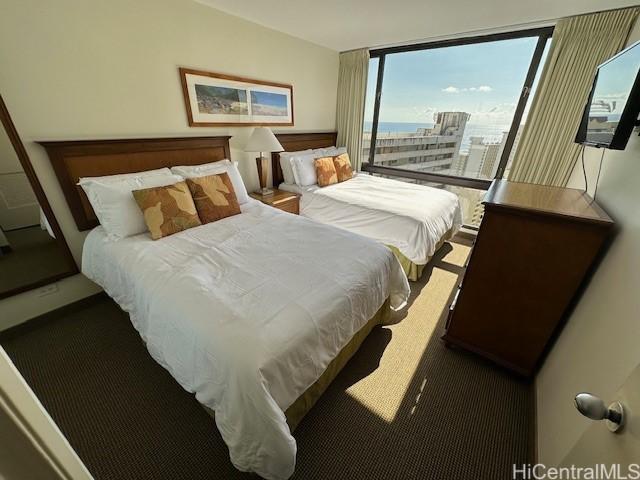 bedroom featuring expansive windows