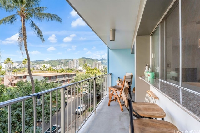 balcony featuring a mountain view