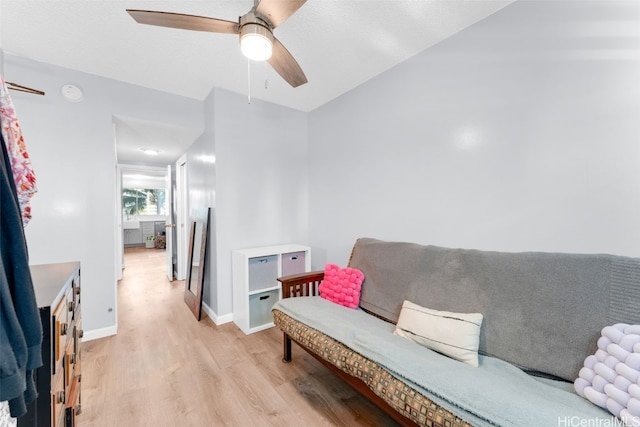 interior space with ceiling fan and light hardwood / wood-style floors