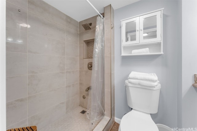 bathroom with toilet and walk in shower