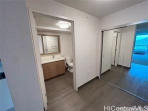 hallway with dark hardwood / wood-style floors