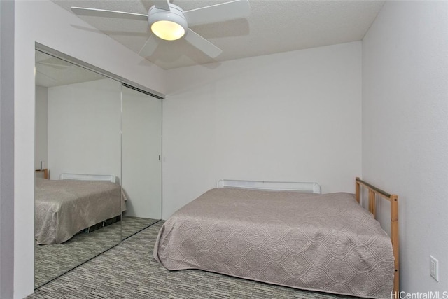 bedroom featuring ceiling fan and a closet