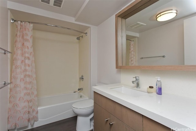 full bathroom featuring toilet, shower / bathtub combination with curtain, hardwood / wood-style floors, and vanity