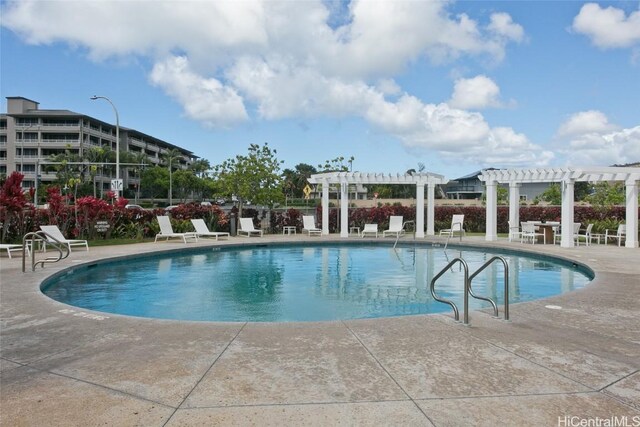 view of pool featuring a pergola and a patio