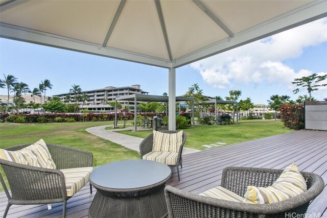 wooden deck featuring a yard