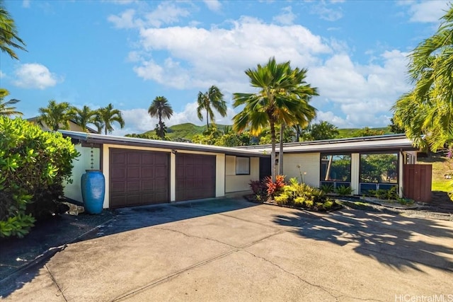 view of front of property featuring an attached garage and driveway