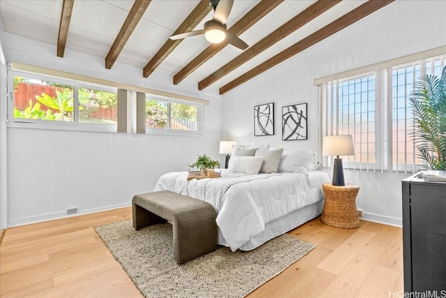 bedroom with vaulted ceiling with beams, light wood-style floors, and ceiling fan