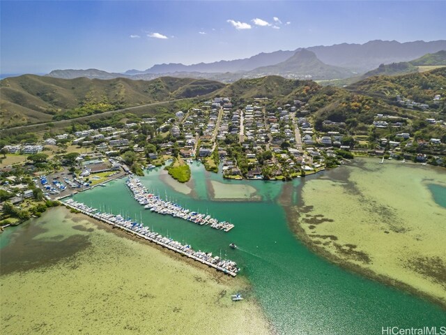 aerial view featuring a water and mountain view