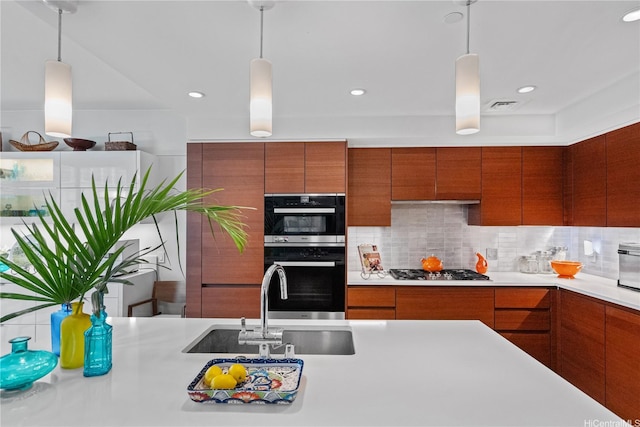 1108 Auahi St Unit 315, Honolulu, HI 96814 - kitchen featuring light countertops, brown cabinetry, modern cabinets, tasteful backsplash, and recessed lighting