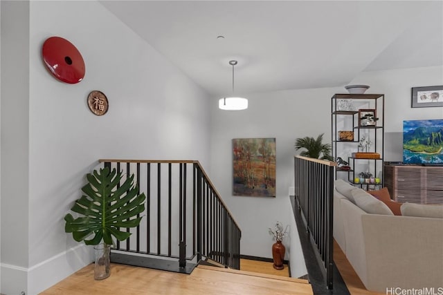 staircase featuring hardwood / wood-style flooring