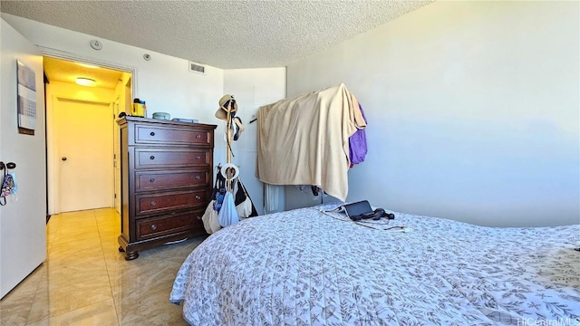 bedroom with a textured ceiling